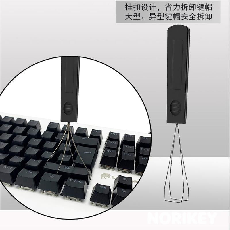 Switch puller prongs gripping a mechanical keyboard switch