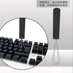 Switch puller prongs gripping a mechanical keyboard switch