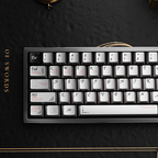 Gray metal style keycaps on a compact mechanical keyboard