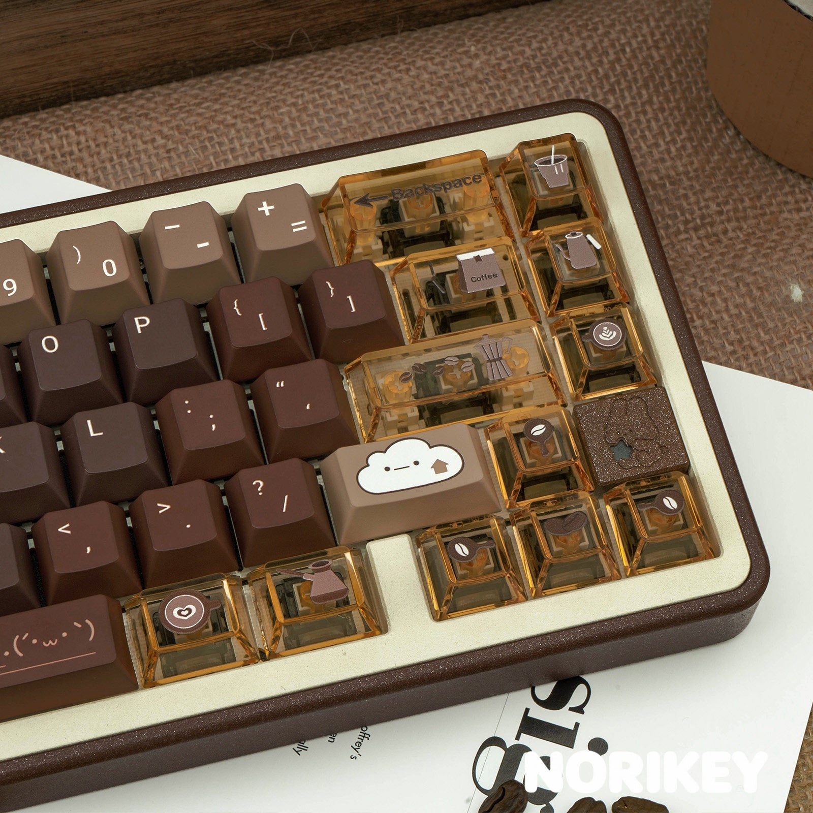 Close-up shot of amber transparent PC modifier keys with custom coffee icons