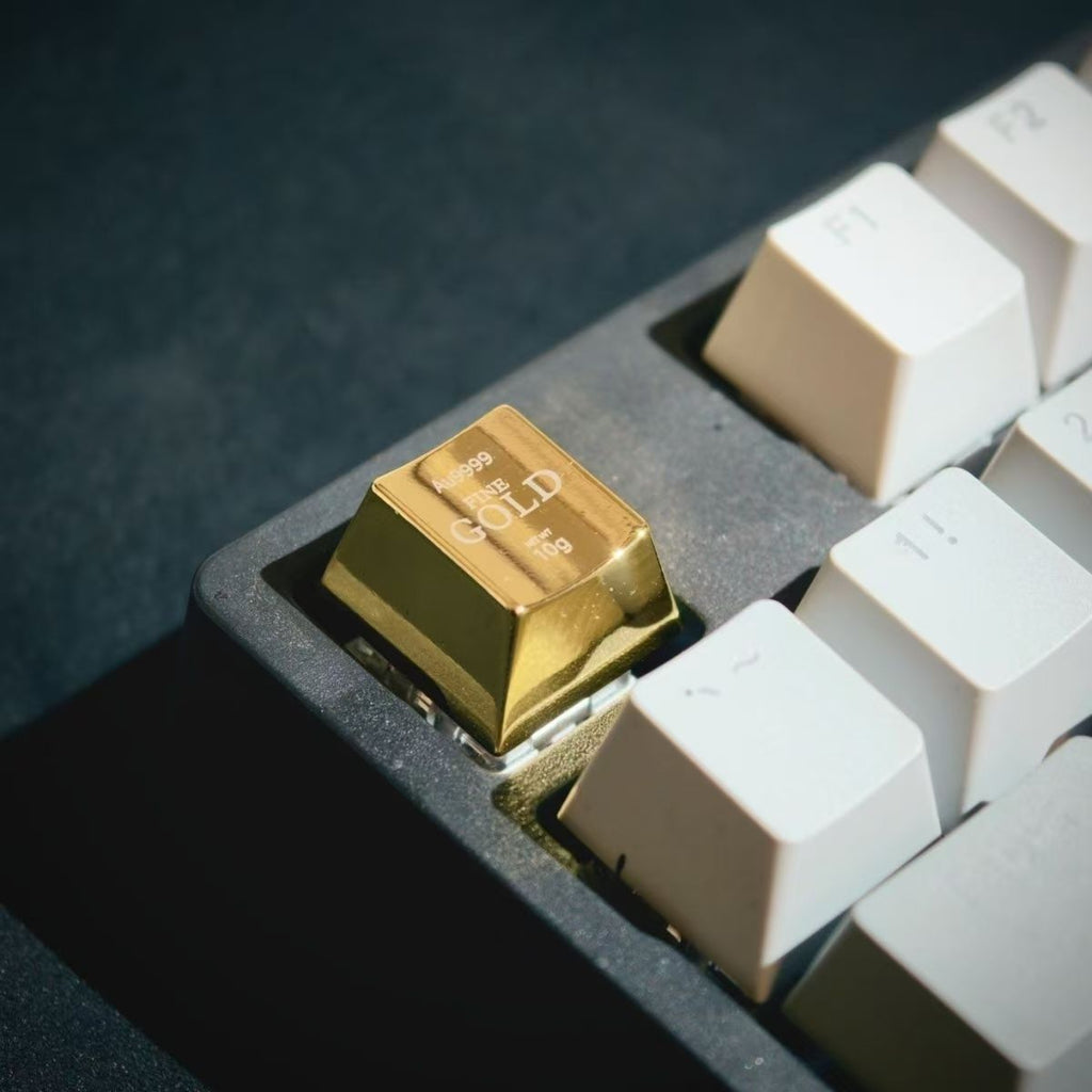 Customized gold bar keycap installed on a white gaming keyboard setup for desk aesthetic
