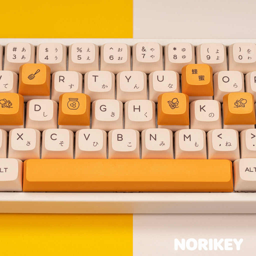 Top view of Honey Milk PBT dye-sub keycap set showing full Cherry profile layout with kawaii character legends