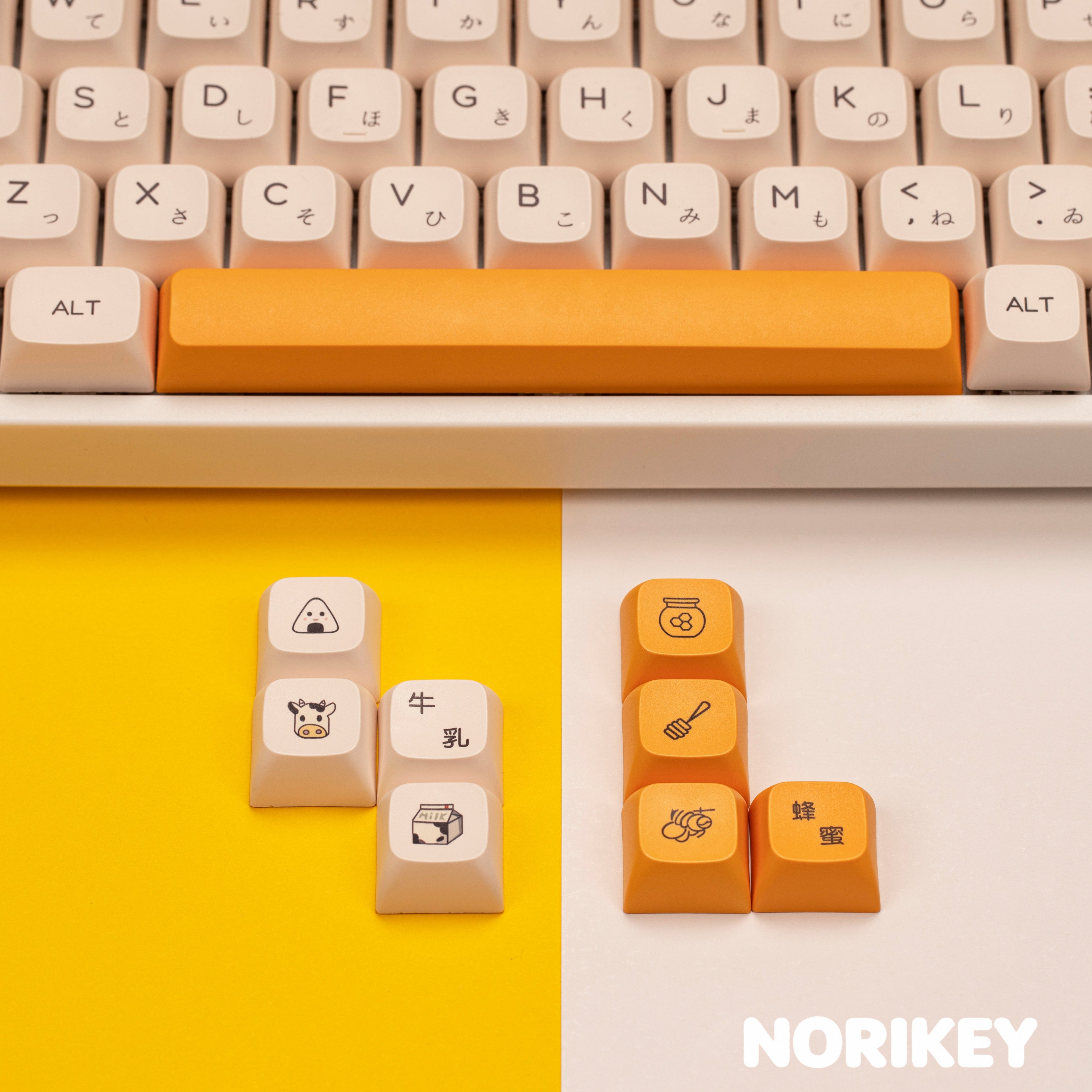 Close-up of cute modifier keycaps with illustrated bear and honey characters on Cherry profile PBT dye sublimation keycaps