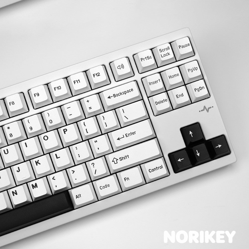 Underside of a doubleshot keycap showing the two-piece moulding and Cherry MX cross stem